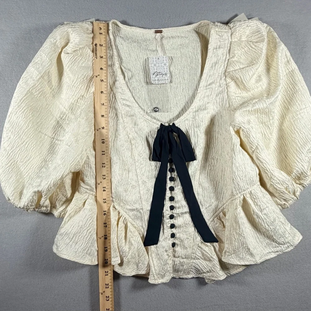Free People NWT Ivory Textured Puff Sleeve Peplum Top Black Tie Bow Size P